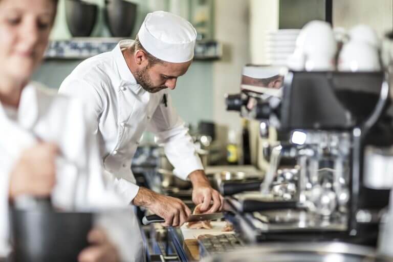 Chef preparing food in kitchen finance